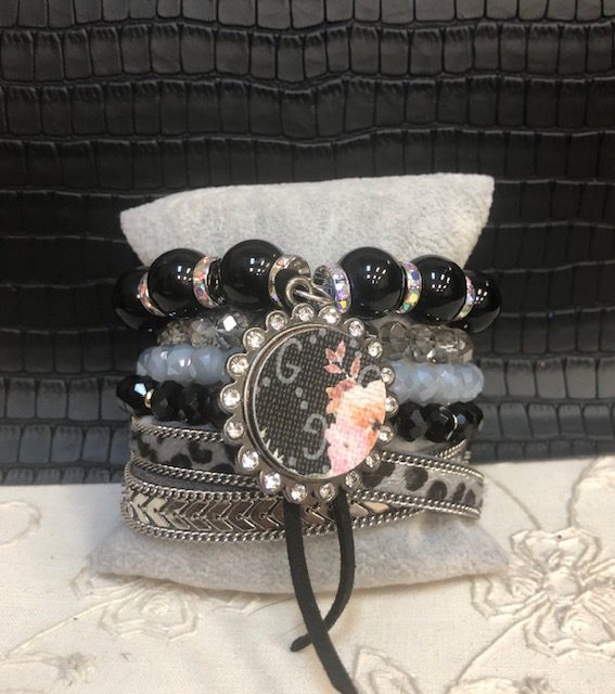 A bracelet with black and white beads on it