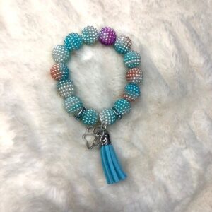 A GIRLS MULTI BUBBLEGUM BRACELET with turquoise beads and a tassel.
