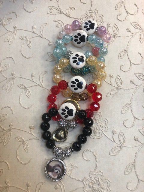 A row of bracelets with different colors and designs.