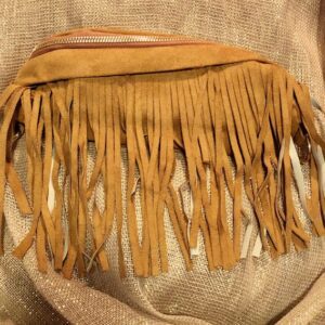 A close up of the fringed edge on a purse