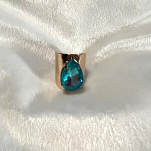 A gold ring with a blue topaz stone.
Product Name: GOLD RING WITH AQUA TEARDROP