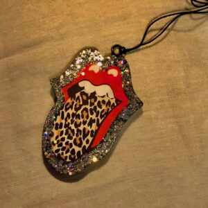 A Rolling Stone Freshie charm with a leopard print.