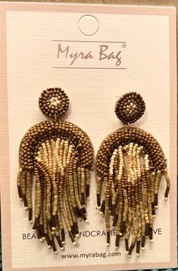 A pair of earrings on display in front of a white card.