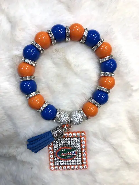 A Gator Game Day Bracelet with a Florida Gators charm and tassel.