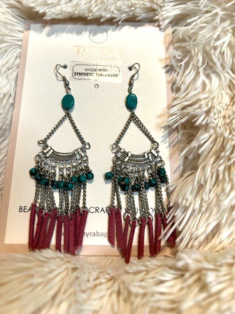 A pair of LOOM LIFE SILVER EARRINGS with tassels and beads.