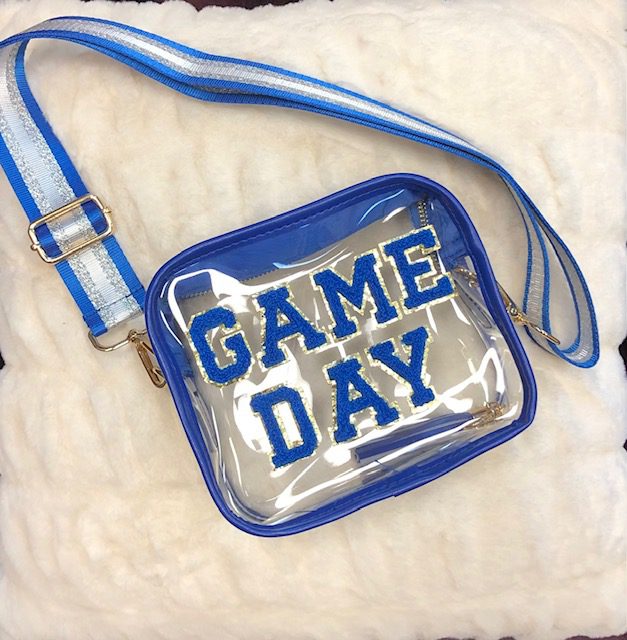 A ROYAL BLUE GAME DAY CLEAR PURSE with the word game day on it.