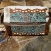 A cowboy style SOUTHWEST MAKEUP KIT with tassels on it.